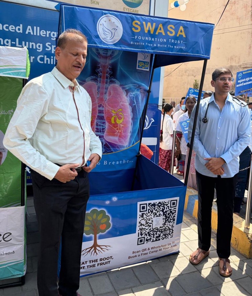 Swasa Foundation Trust outdoor booth with lung display and QR code for booking camps