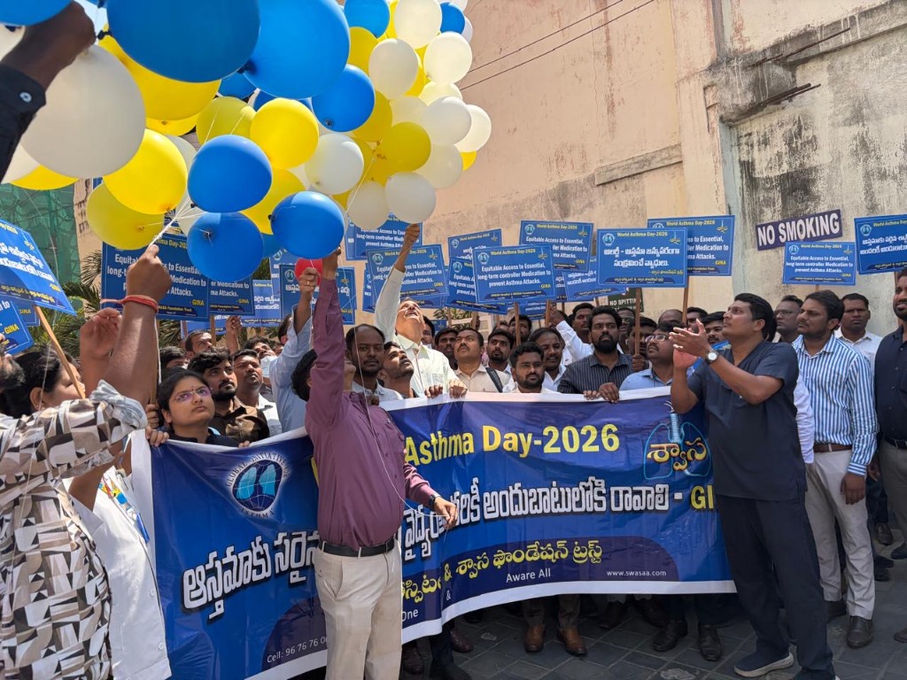 World Asthma Day 2026 rally with balloons, blue banner, and placards