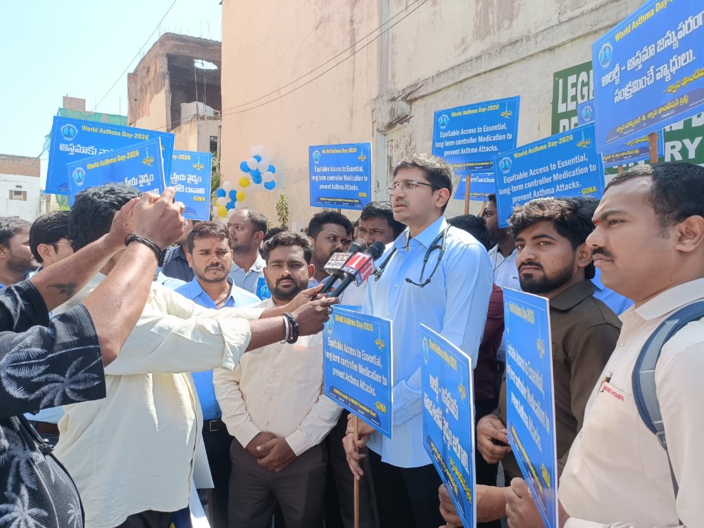 Doctor with stethoscope speaking to television reporters on World Asthma Day 2026